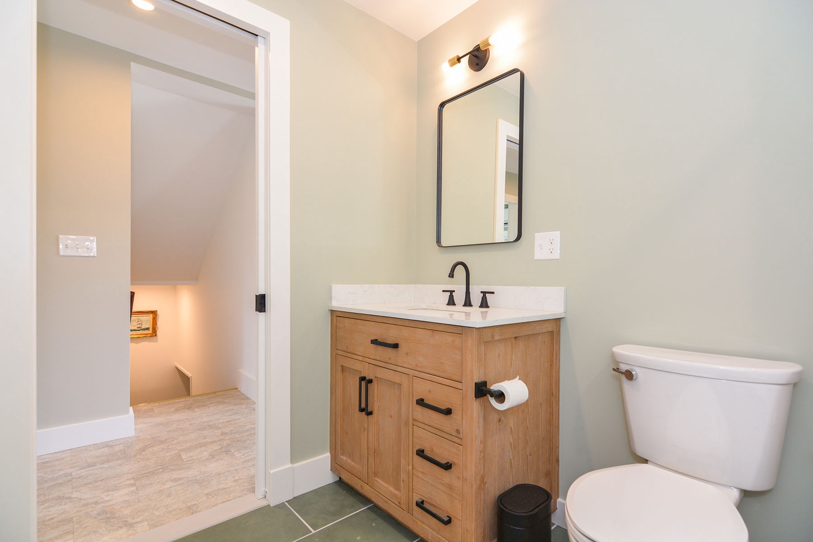 The full bathroom with a tub and shower combo.