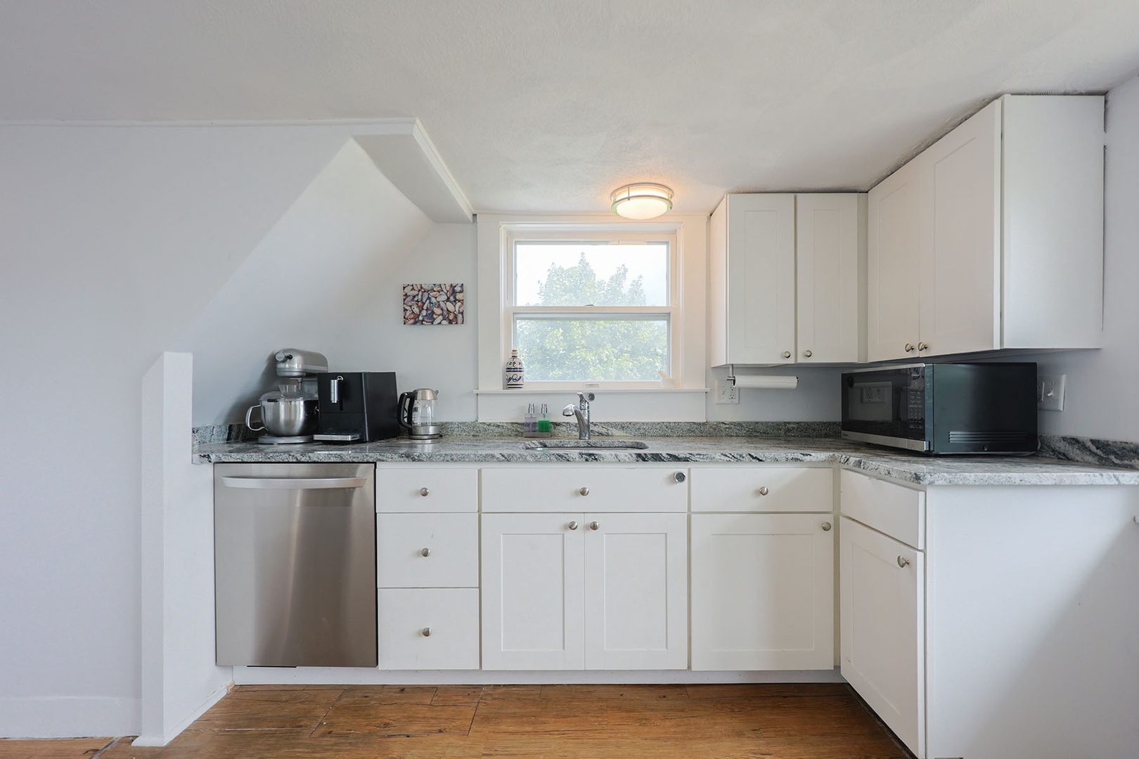 The kitchen has ample space for prep and storage.