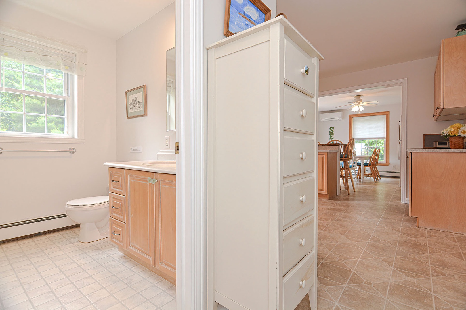 Cabinet outside the full bath.