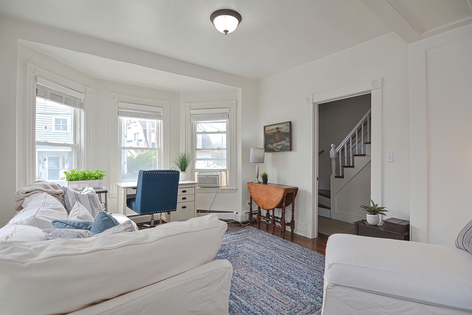 The stairs to the second floor are through the parlor.