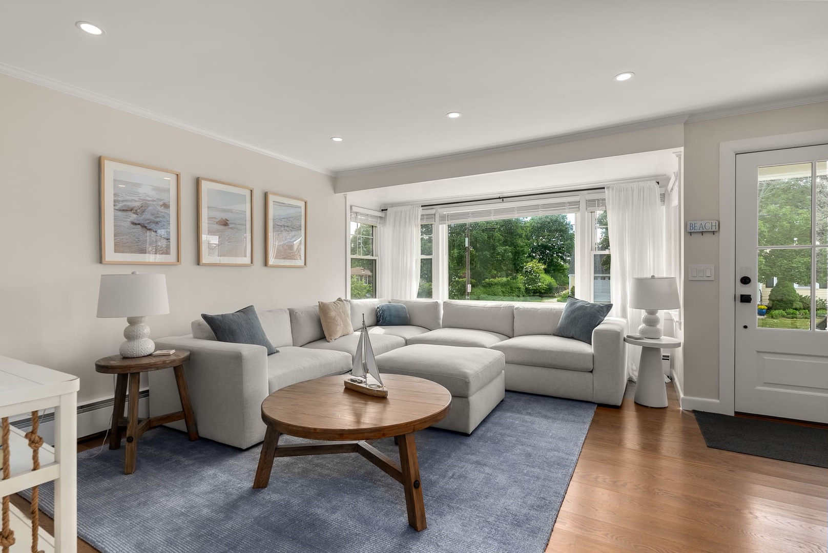 The living room is spacious and brings in plenty of natural light.