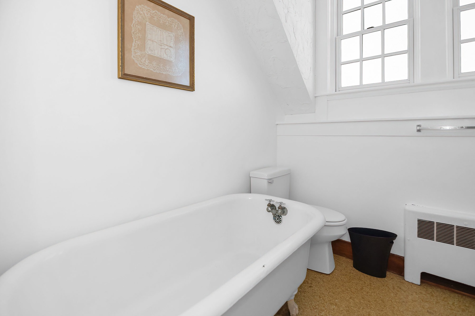 Shared full bath with clawfoot tub and separate shower.