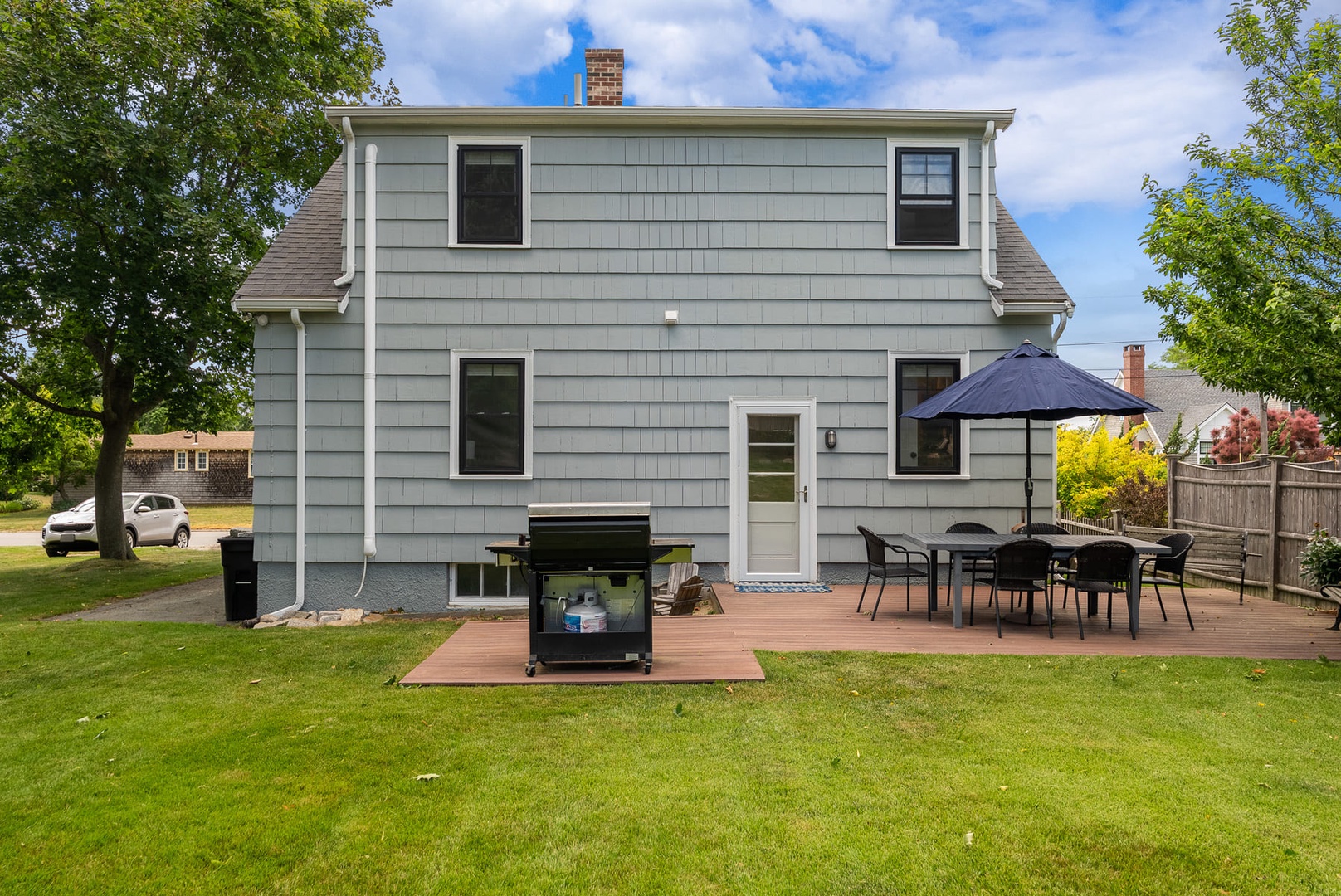 The grill is located right near the patio.