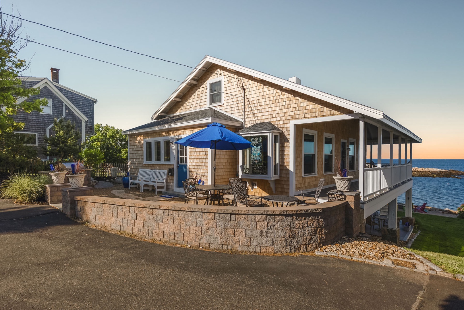 Front of the house with outdoor seating.