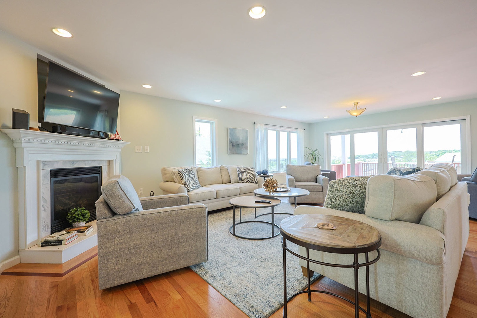 The living room has ample space and a large screen TV