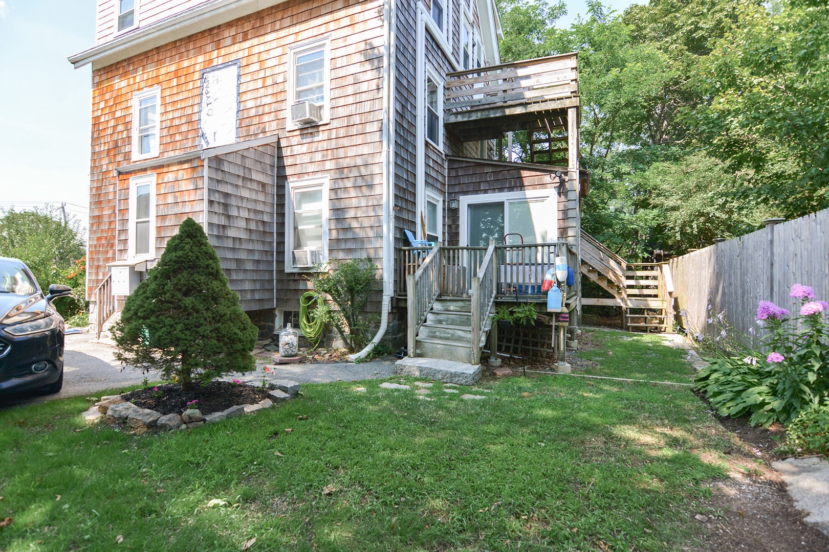 The stairs to entrance are at the back of the house (far right in photo).