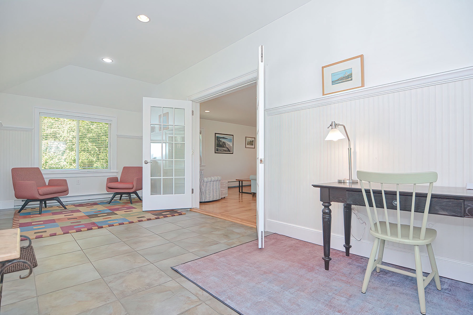 Enter into a front hall with both sitting and working areas.