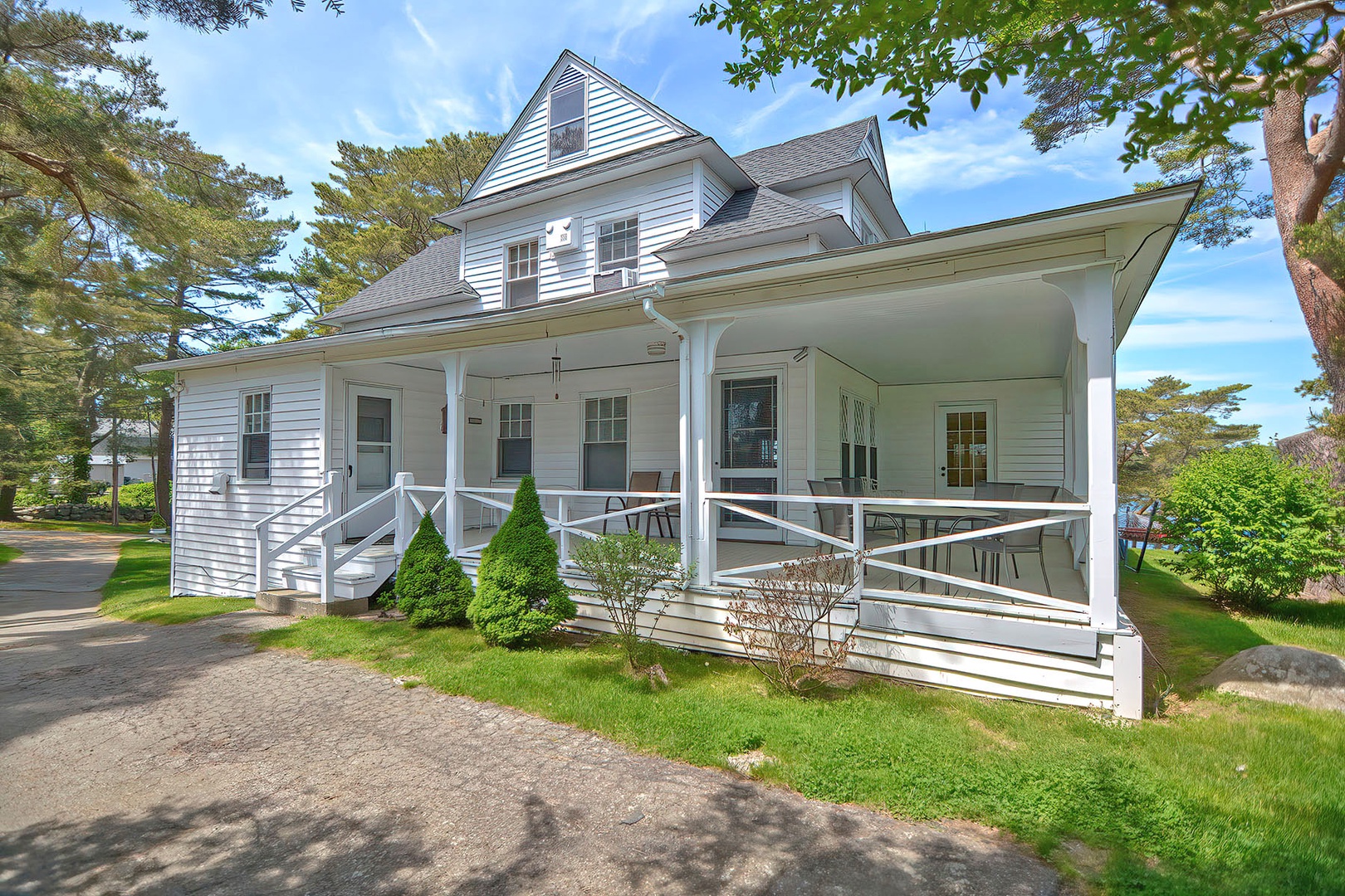 Exterior view of the wraparound deck from the driveway side.