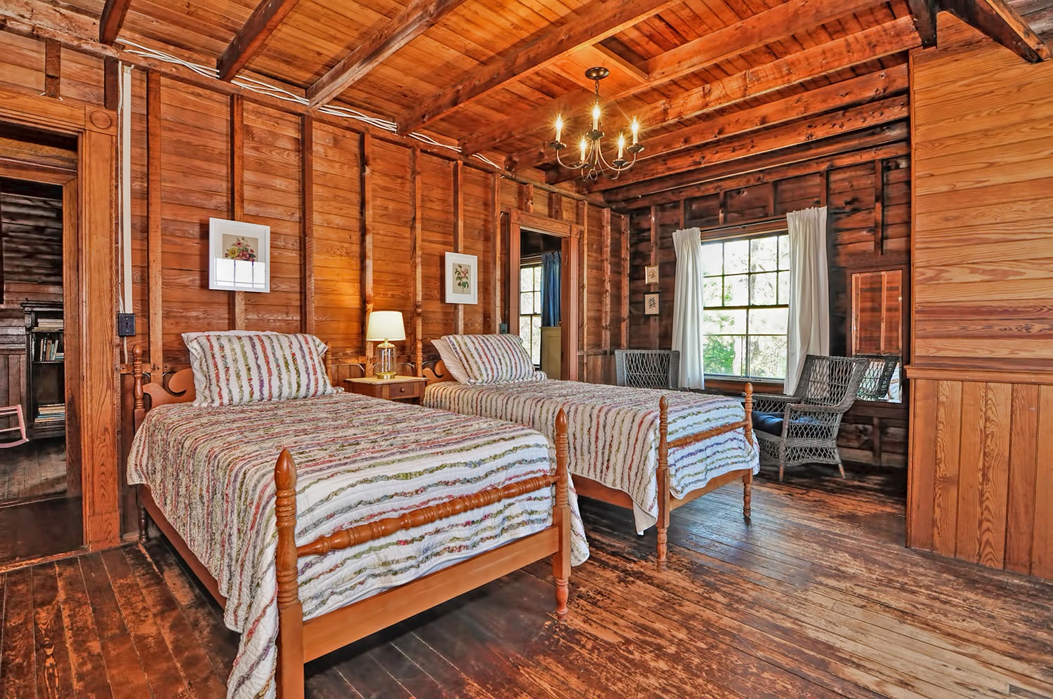 Twin beds and cozy seating area in the Westerly Room.