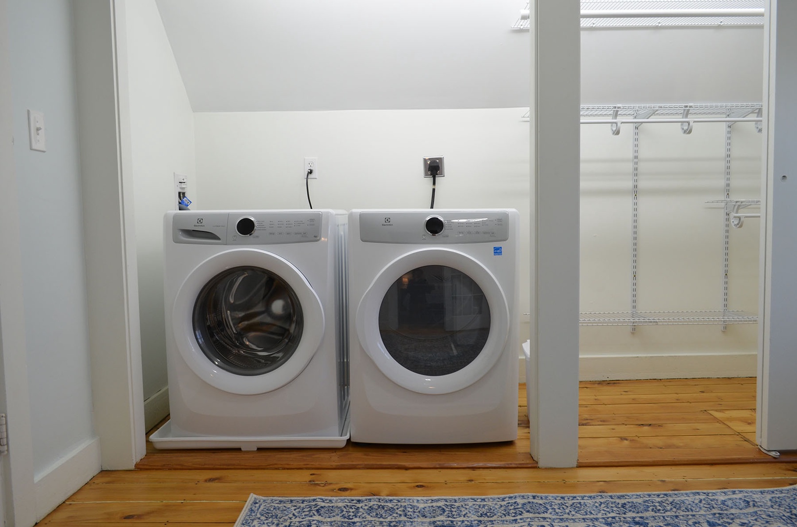 The shared walk-in closet/laundry room connects the bedrooms.