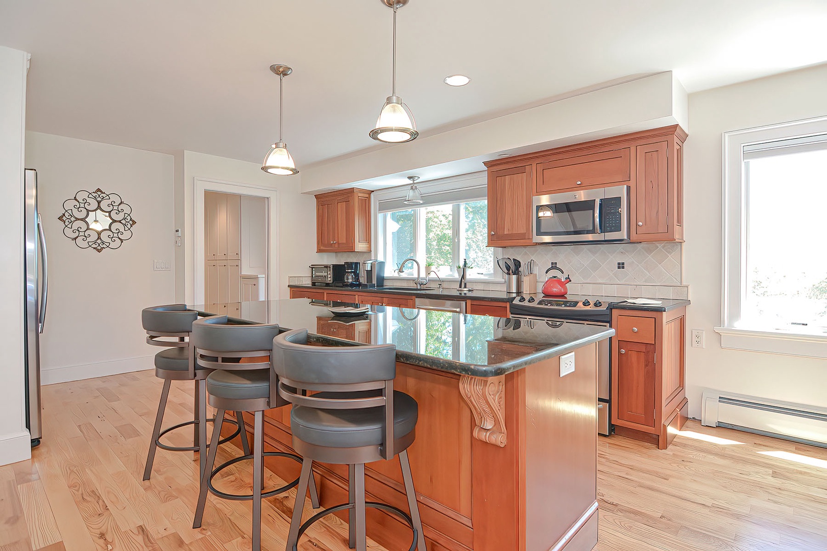 Kitchen with island and bar seating.