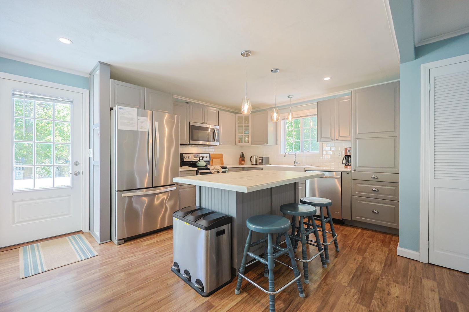 The fully equipped kitchen with stainless steel appliances.