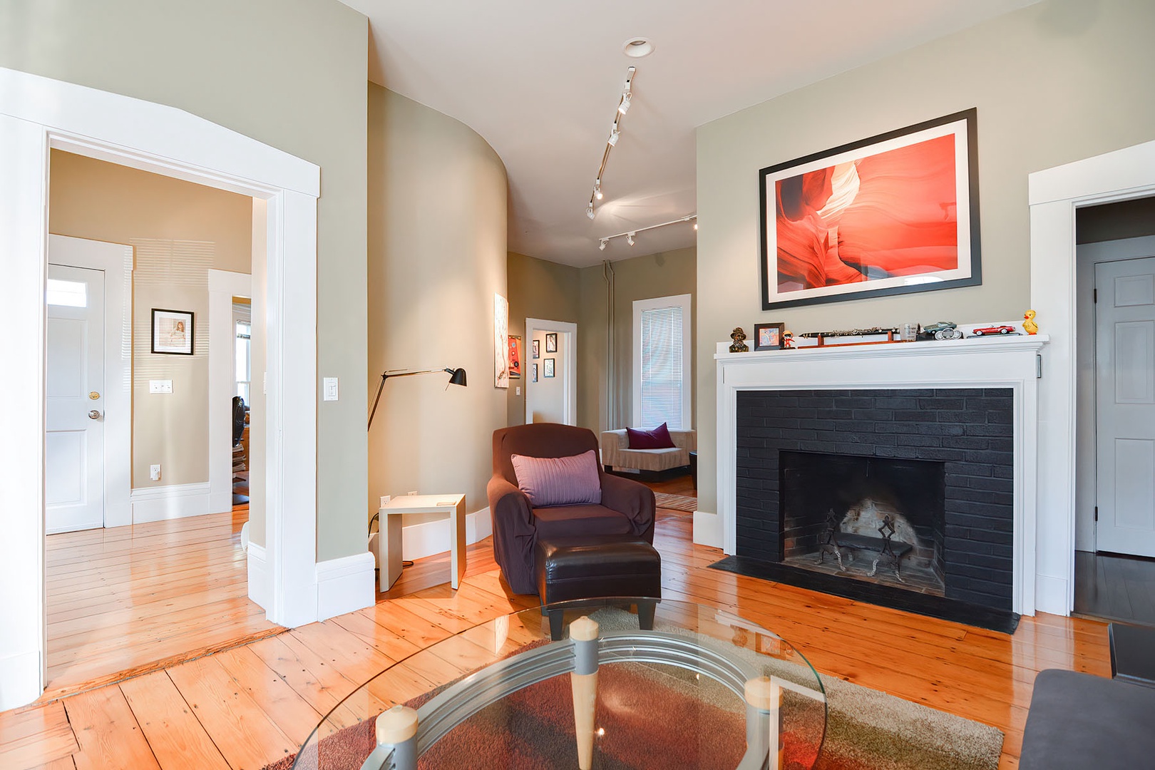 The living room is to the left, across the hall.