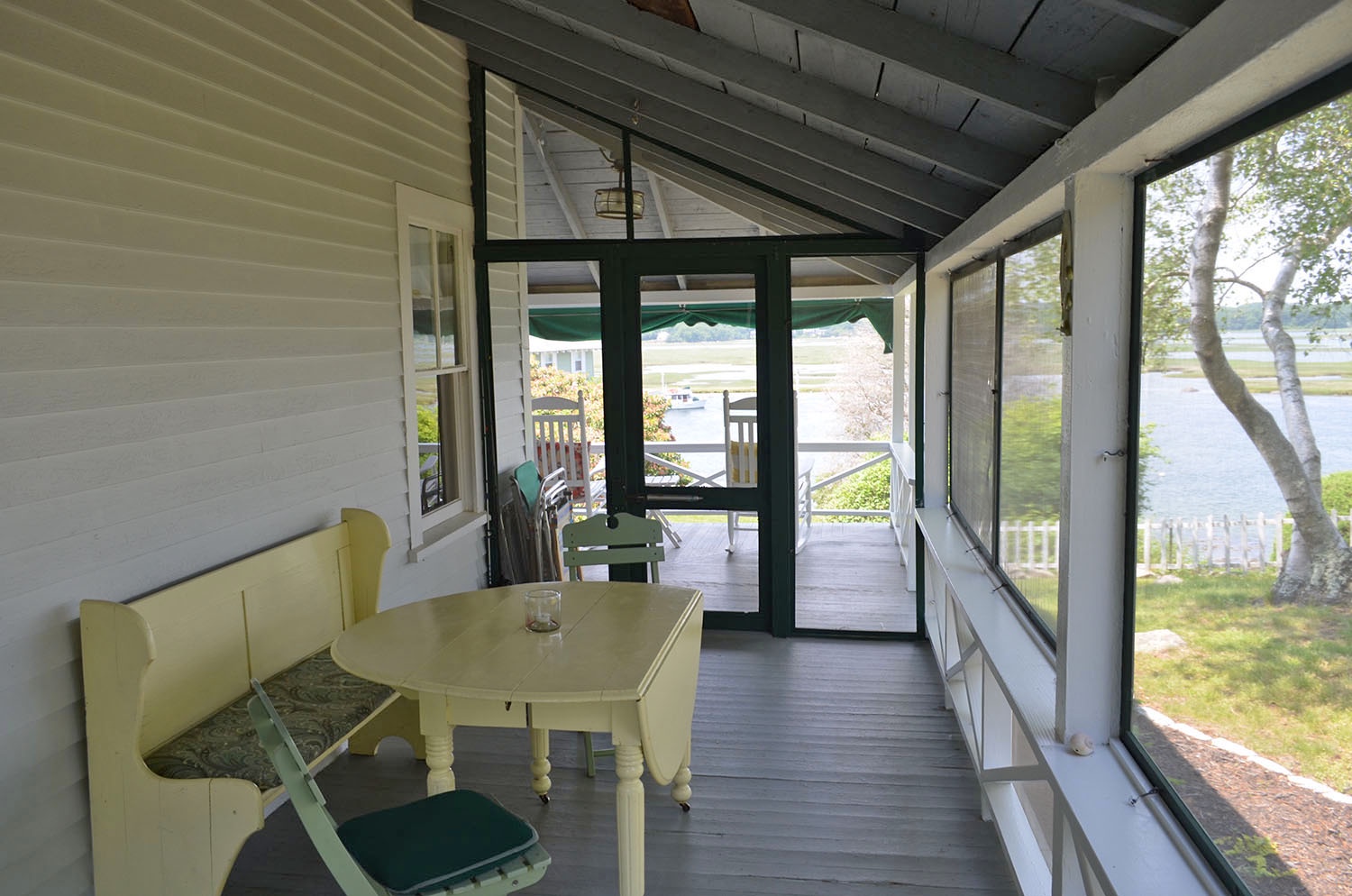 The screened-in section of the wraparound porch.