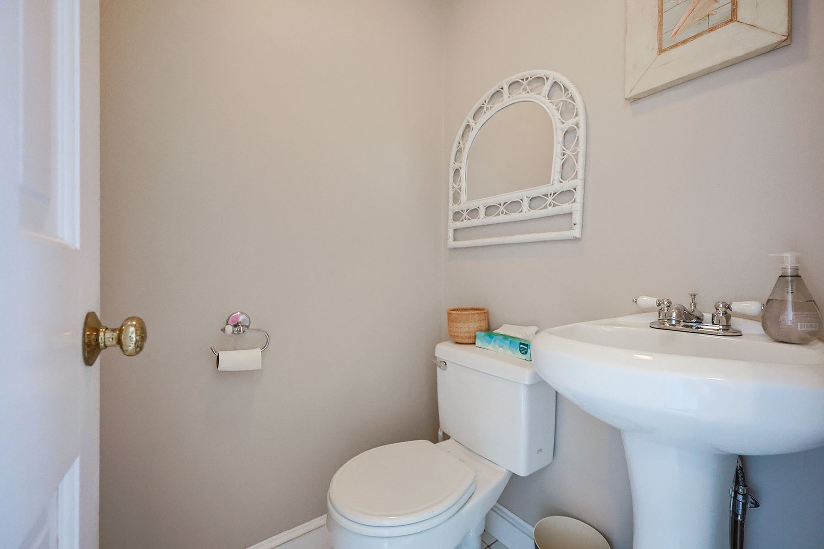 Second half bath beyond the kitchen.