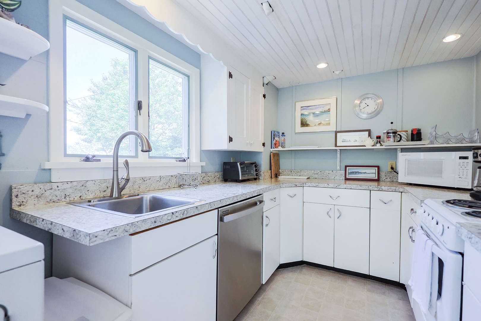 The kitchen is spacious with plenty of room to cook and store essentials.