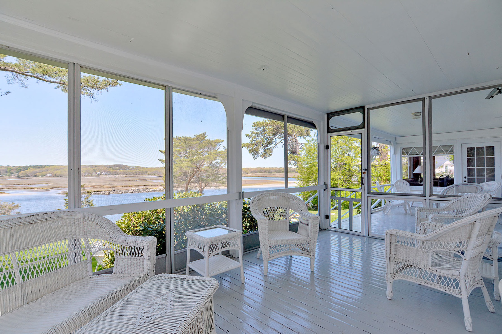 The large wraparound porch offers river views.