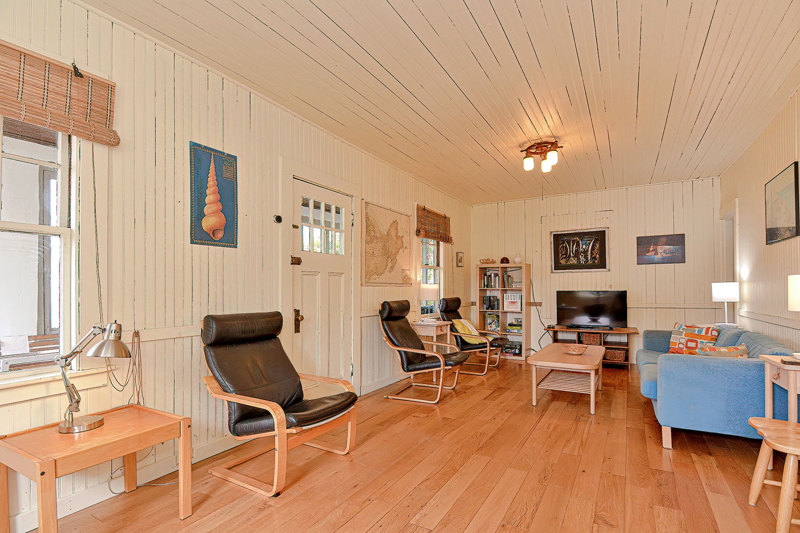 Living room with plenty of seating and a tv