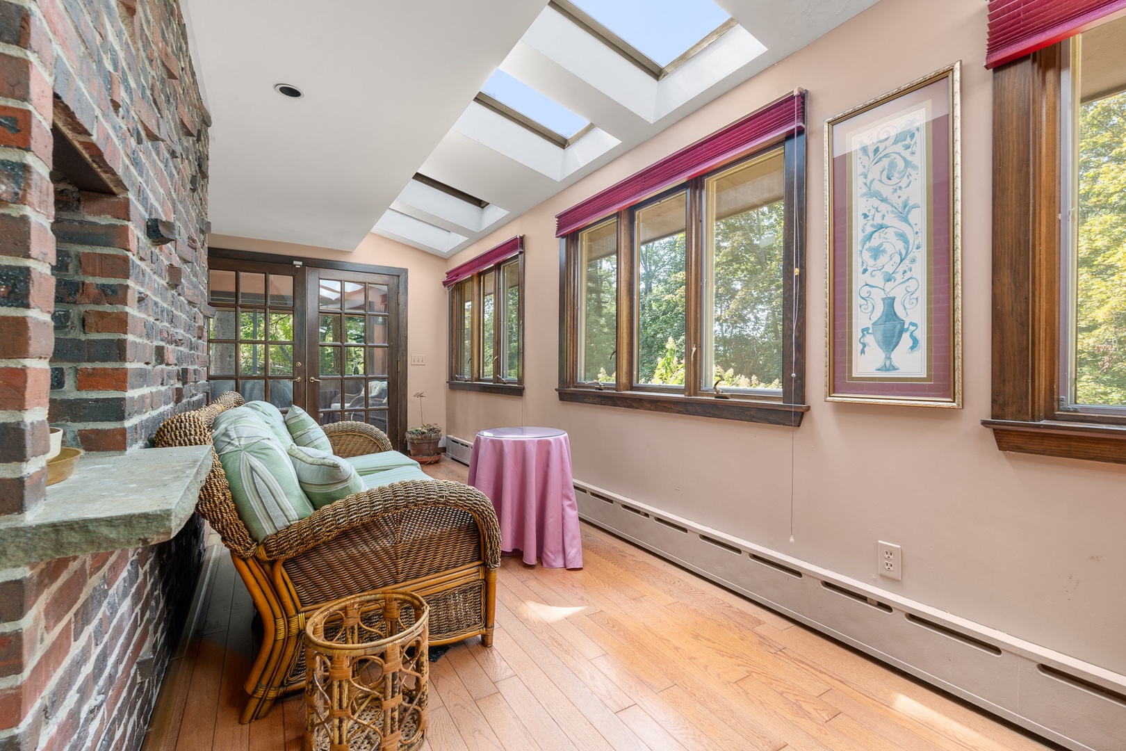 There's a space with a sofa and table opposite to the living room.