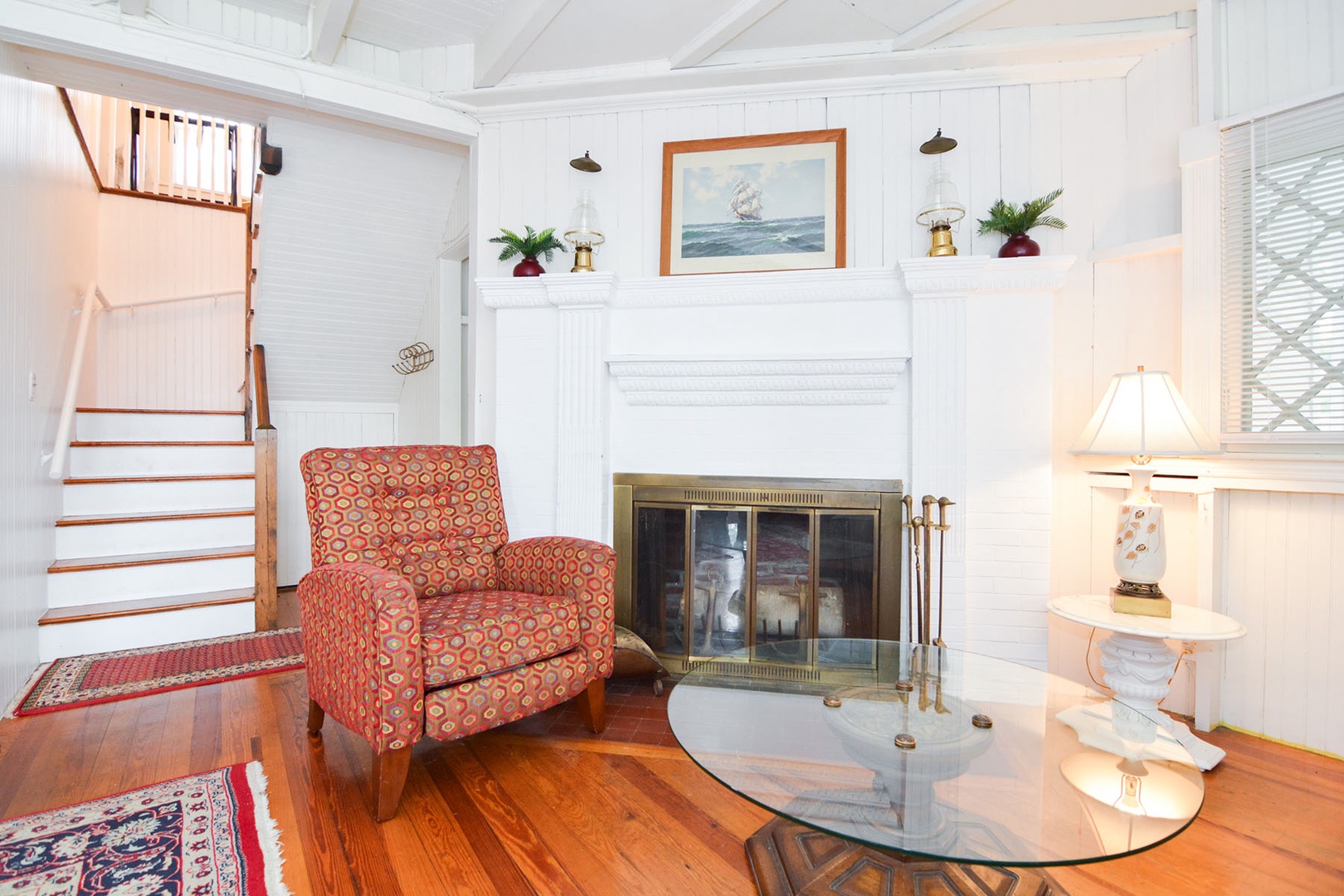 Stairs to the upper floor are accessed via the living room.