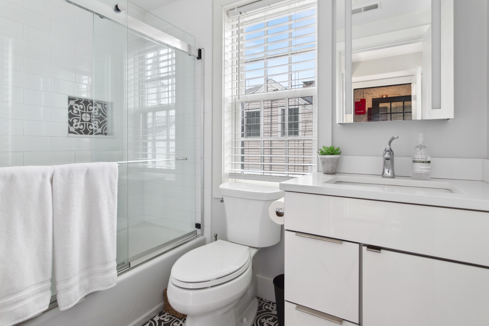 Modern, bright bathroom.