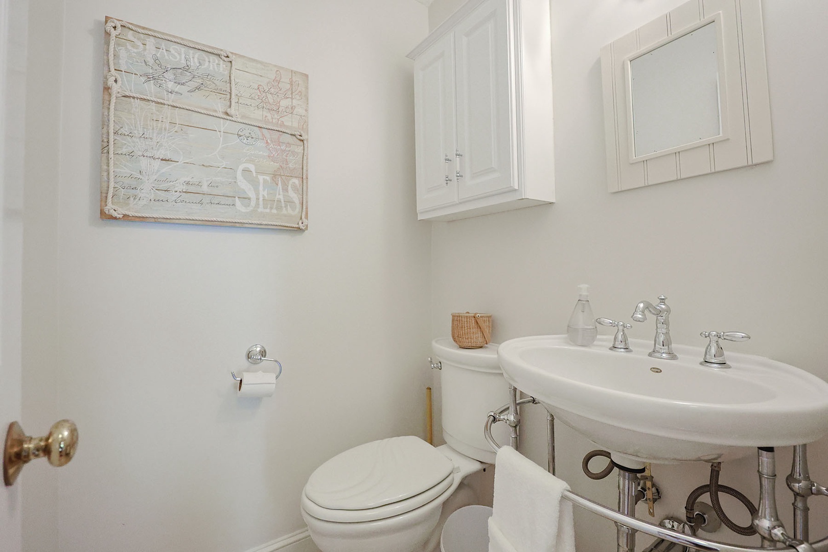 There is a half bath near the living and dining rooms.