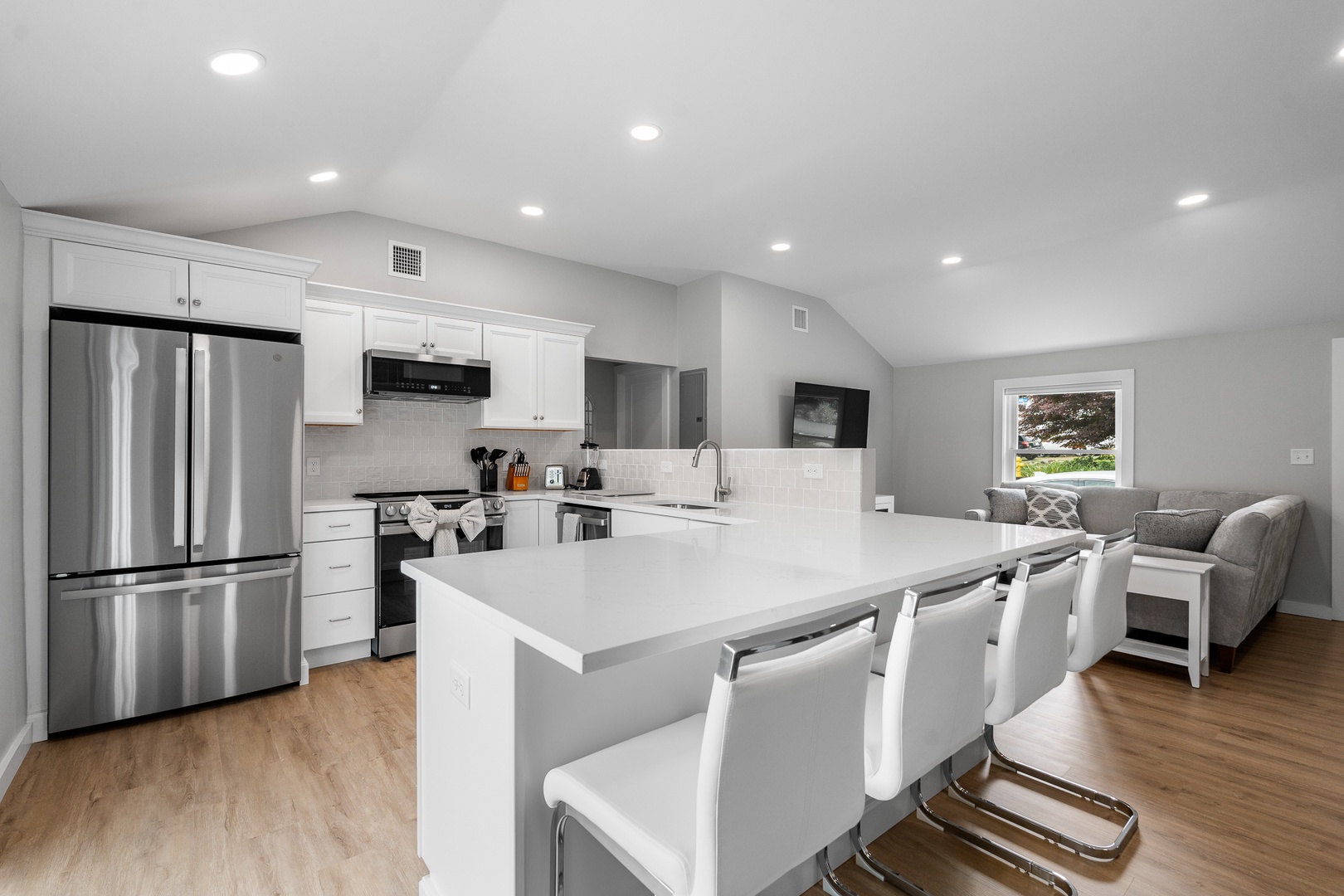 The kitchen counter seats up to four people.