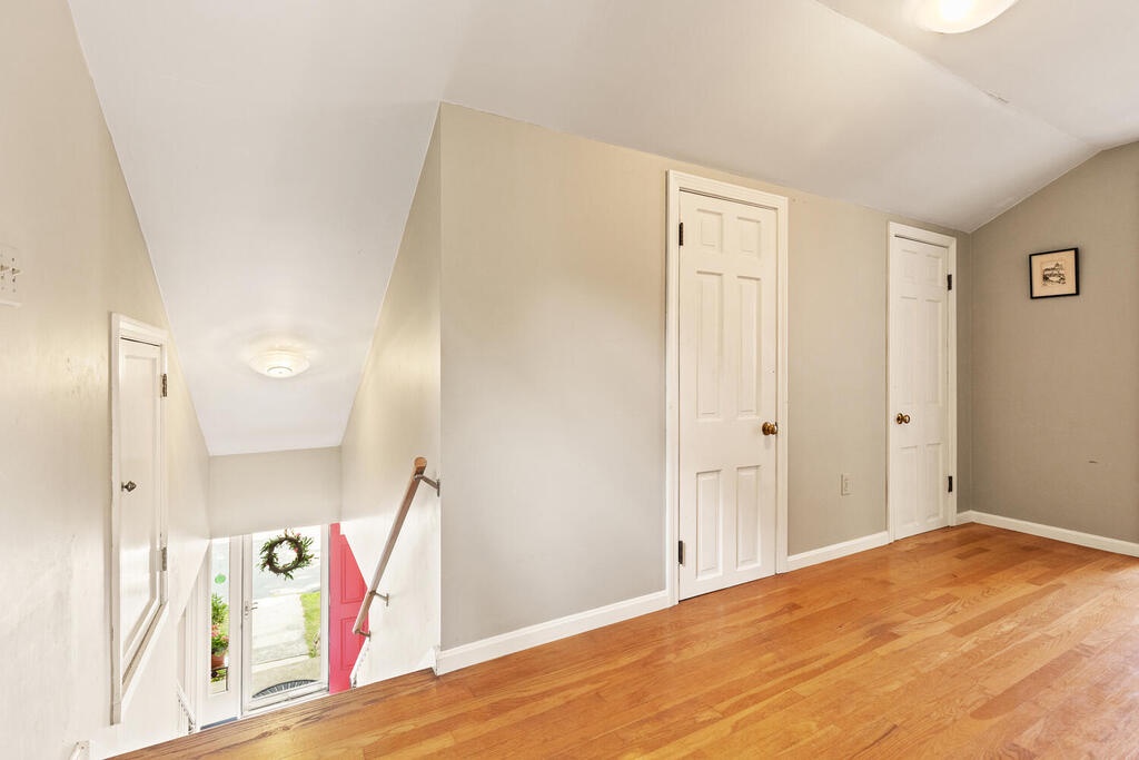 Go up the stairs to access two bedrooms and a hall full bath.