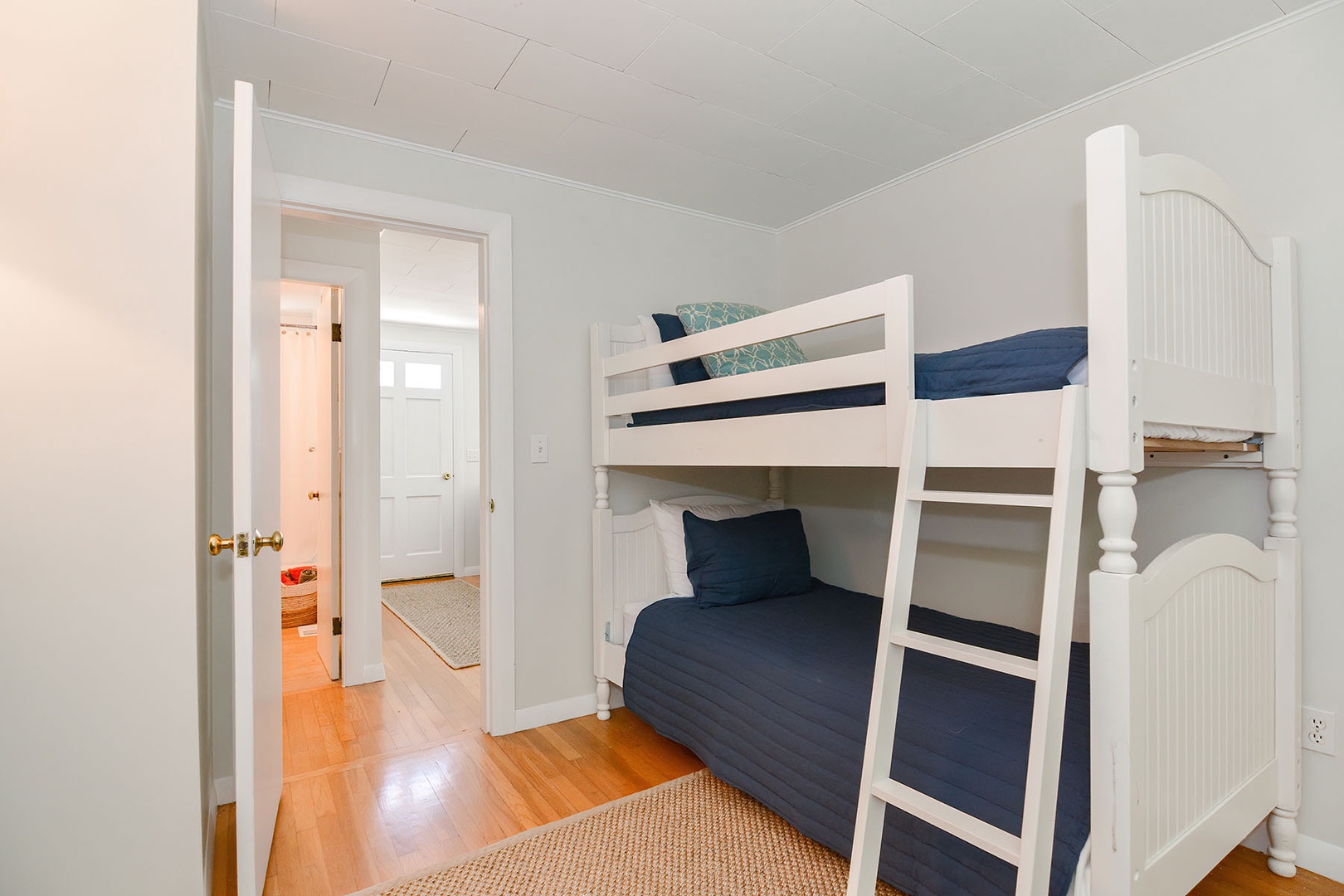 Bunk room with three twins.