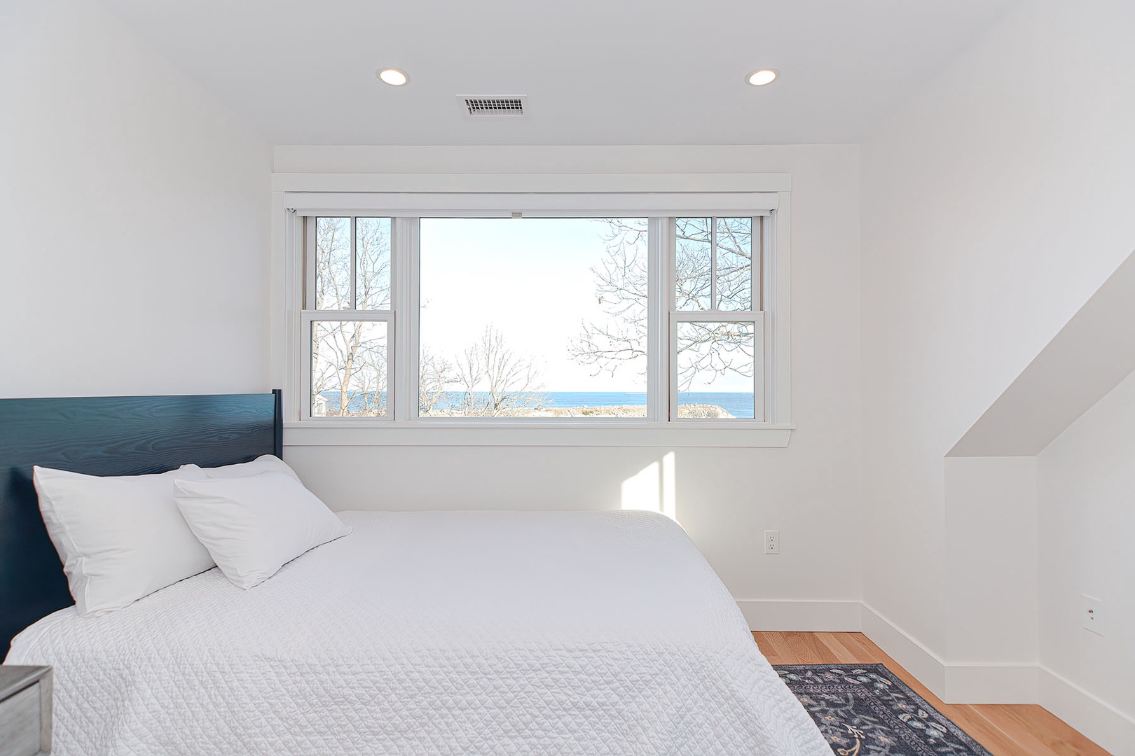 Bedroom 2 with water views from the window.