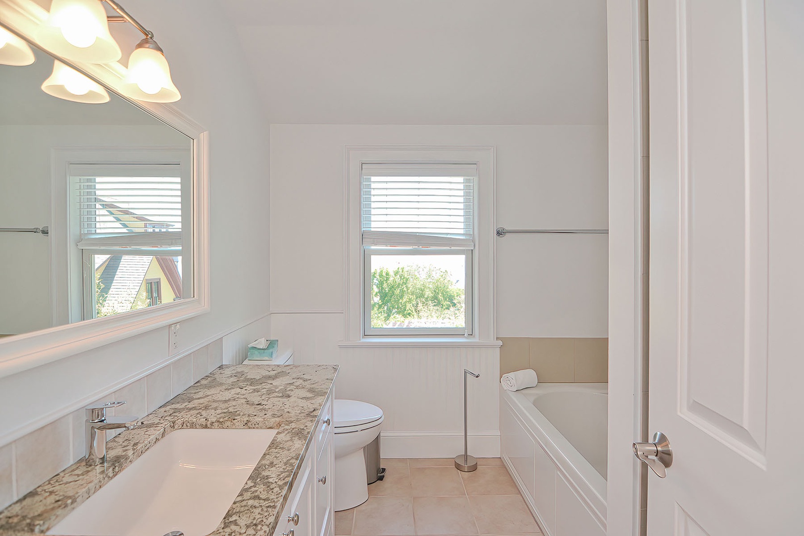 Upstairs full bath with separate tub and shower.