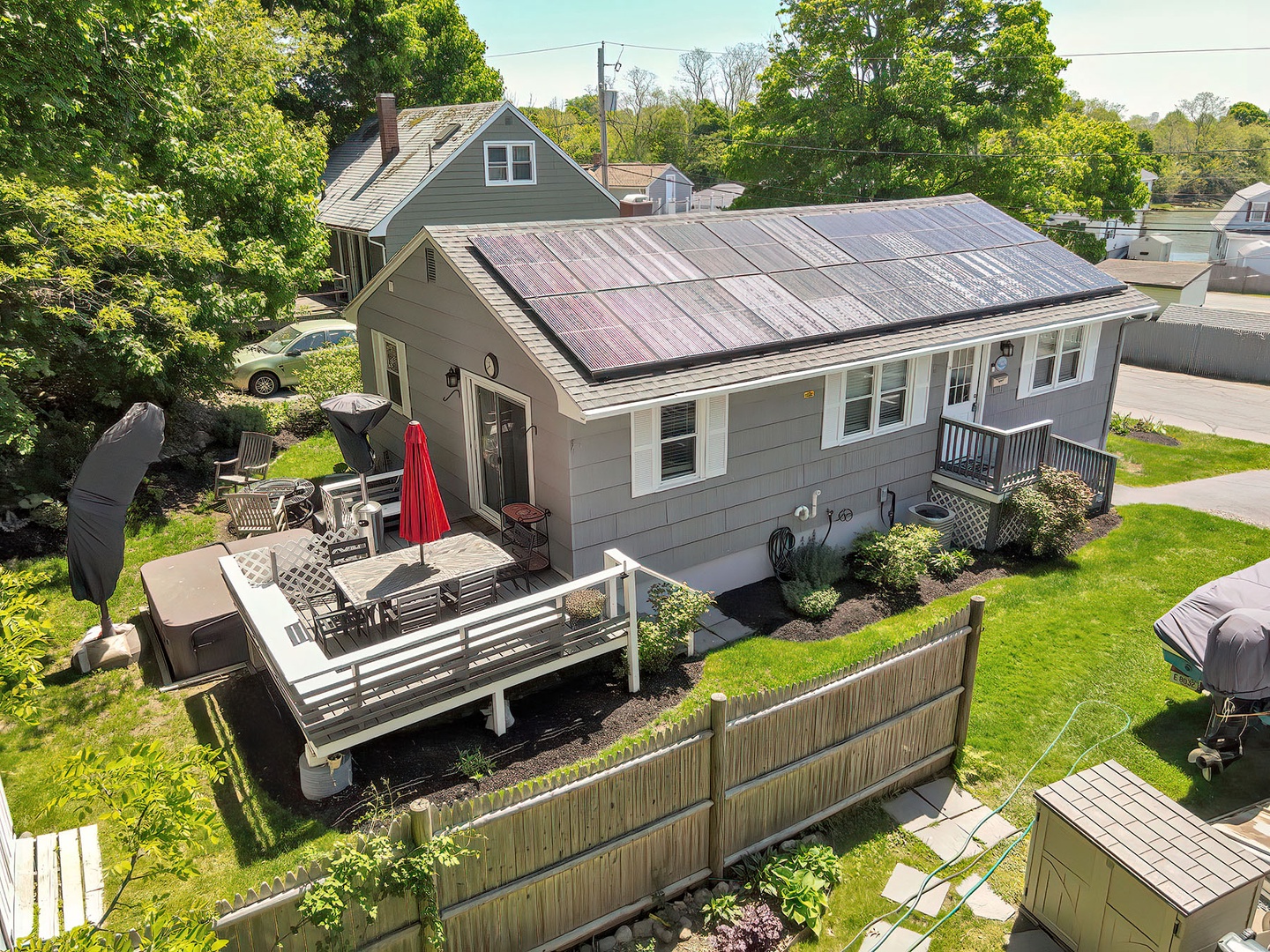 View of back deck with exterior steps, shed, and yard.