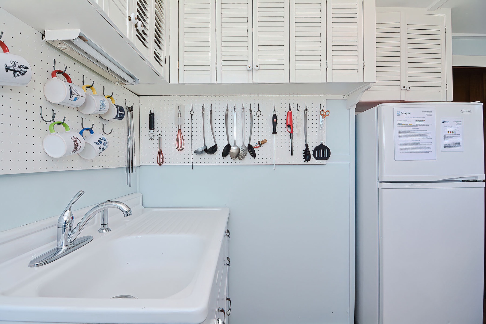 The kitchen is well-equipped with plenty of storage.