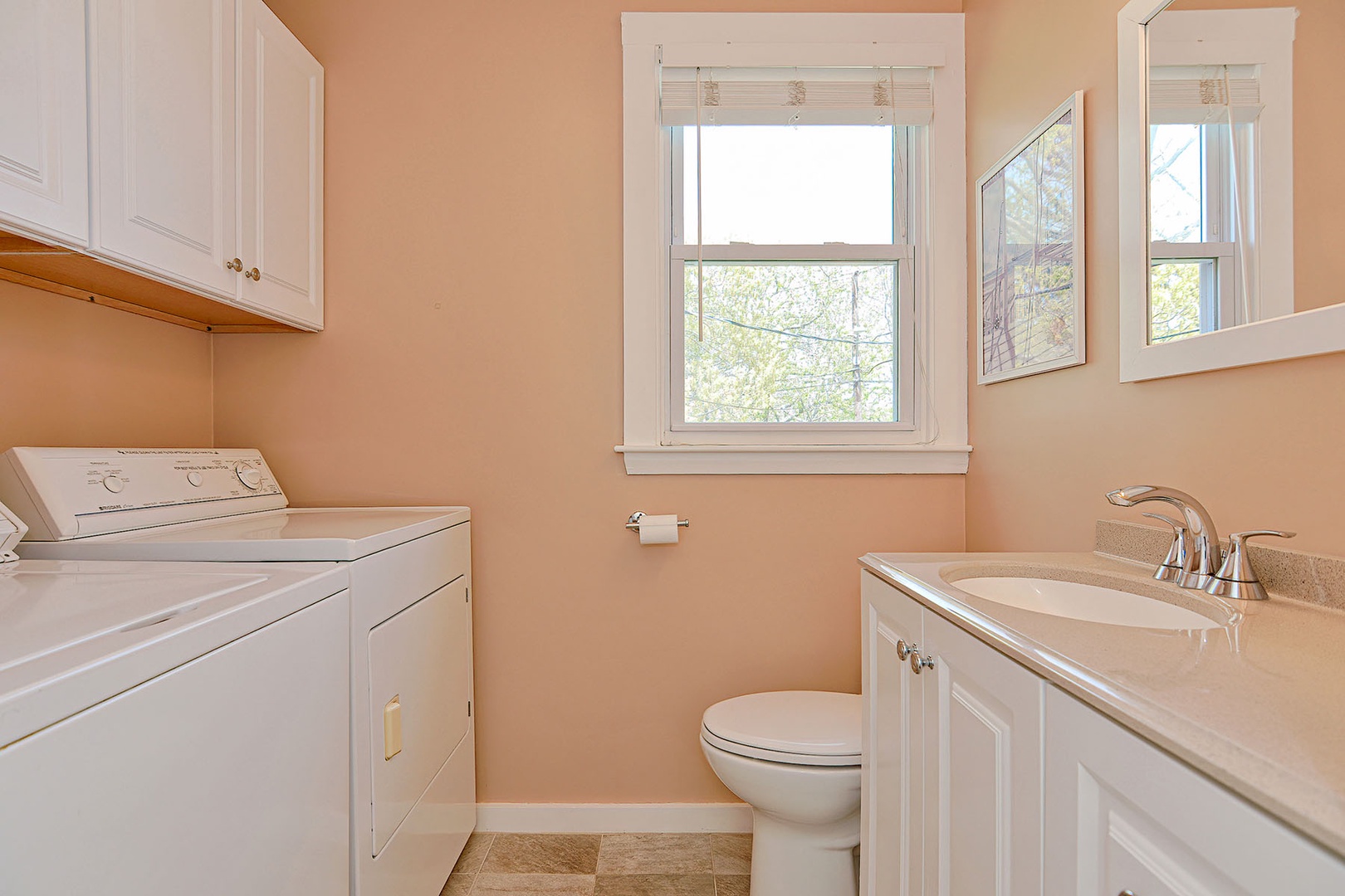 The laundry area is located within Bathroom 2.