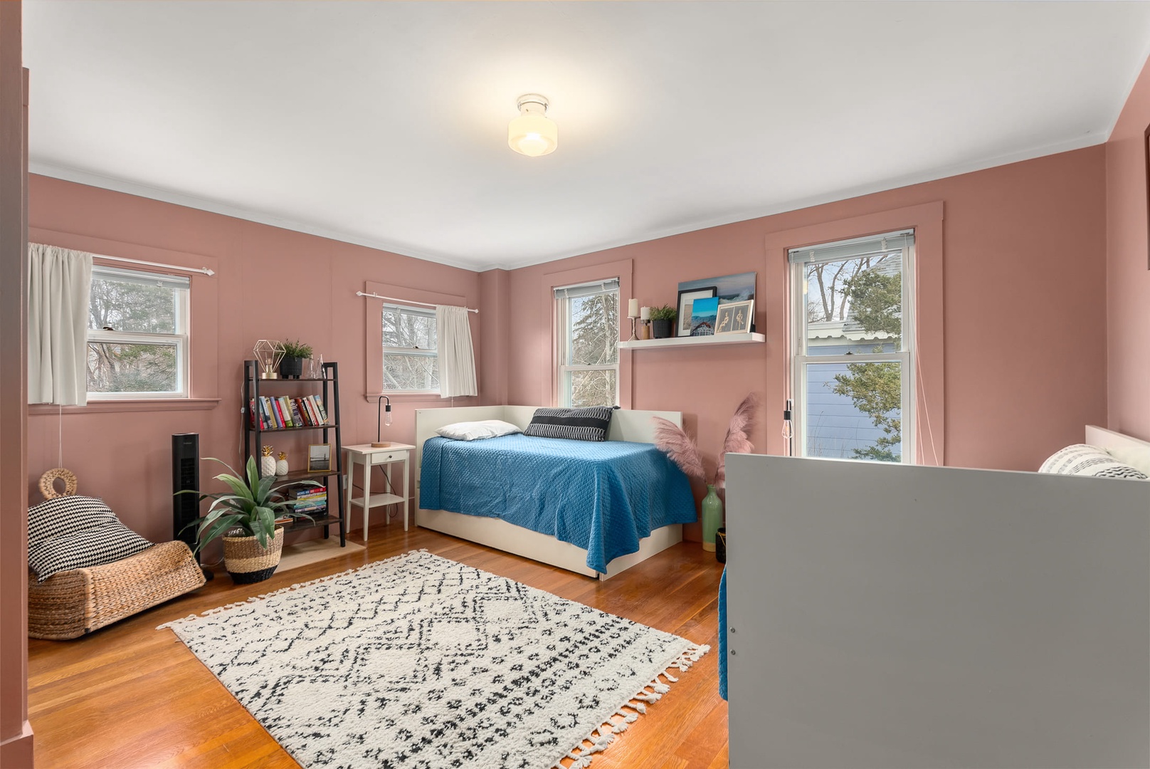 Bedroom 3: A bright corner bedroom with twin beds.