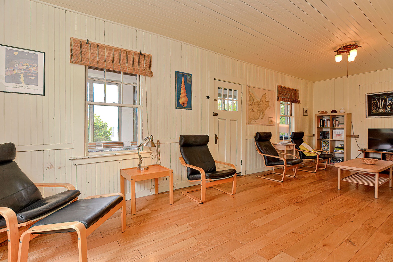 Living room with plenty of seating and a tv