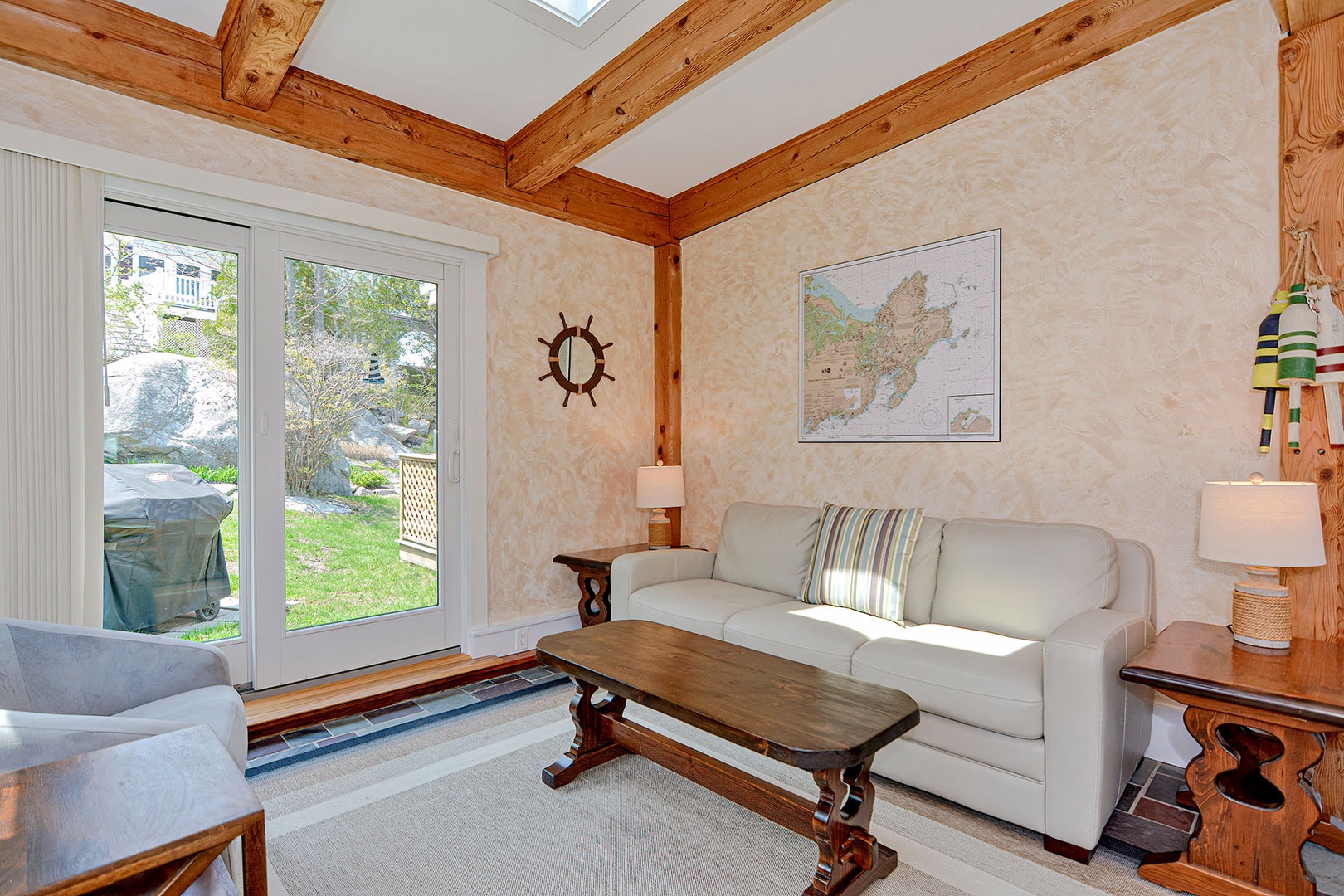 The sun room has a sliding door to the back yard and deck.