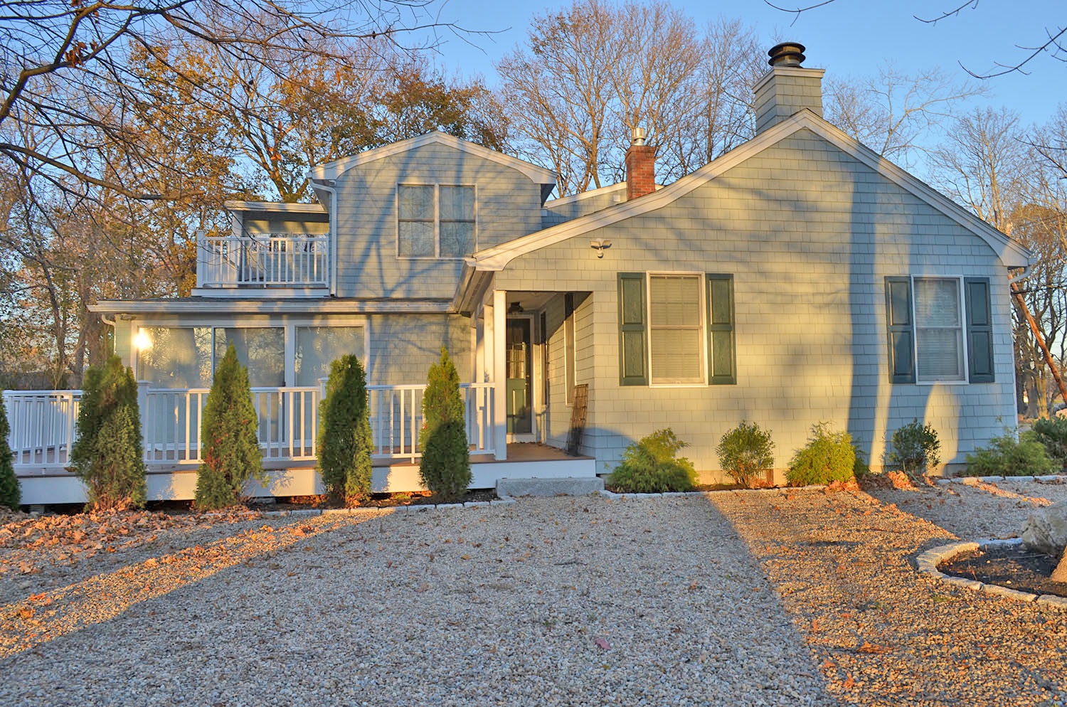 There is a circular driveway on the side of the house.