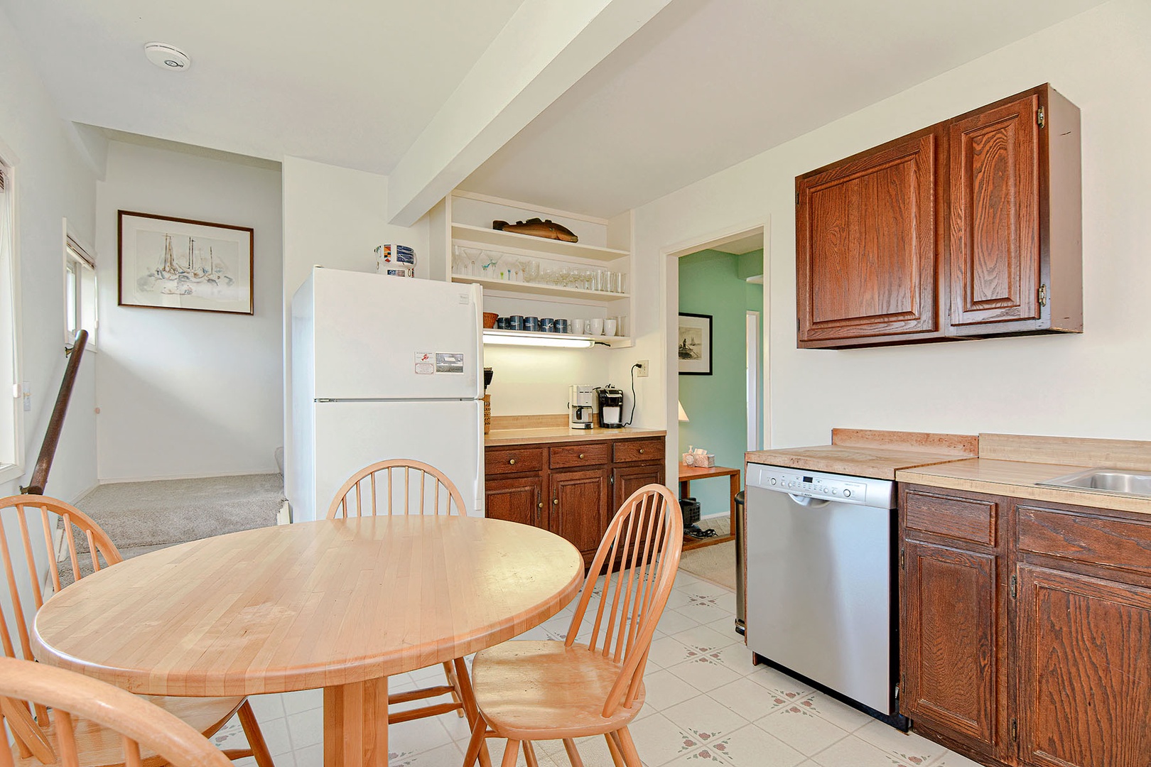 Stairway to the second floor is via the kitchen.