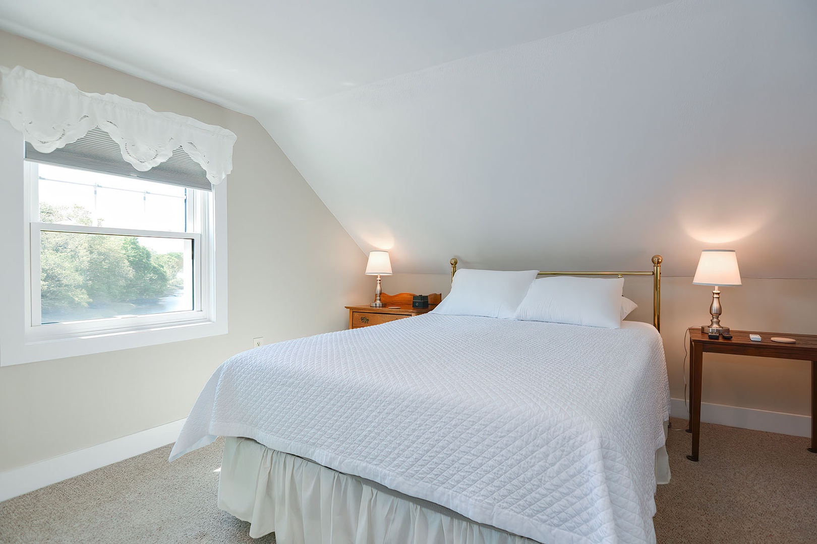 Bedroom 2 includes beautiful views out to the Crane River.