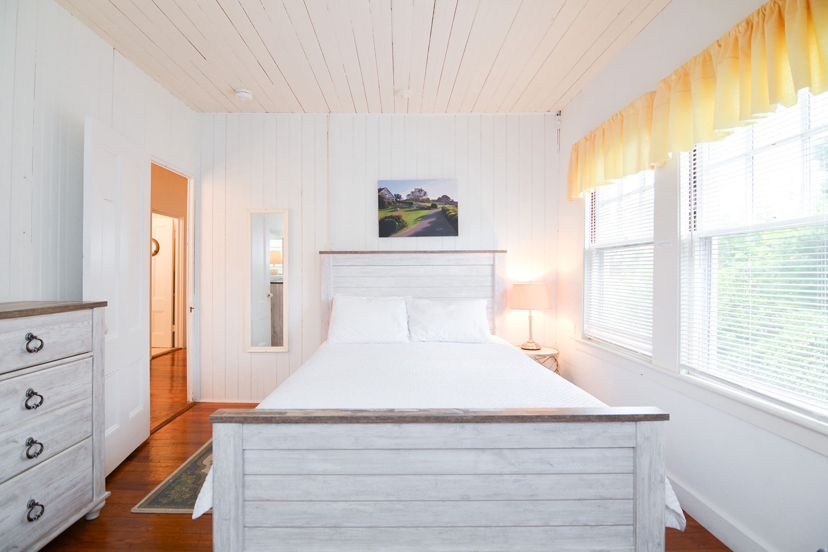 BR 4: Bright and airy Queen bedroom.