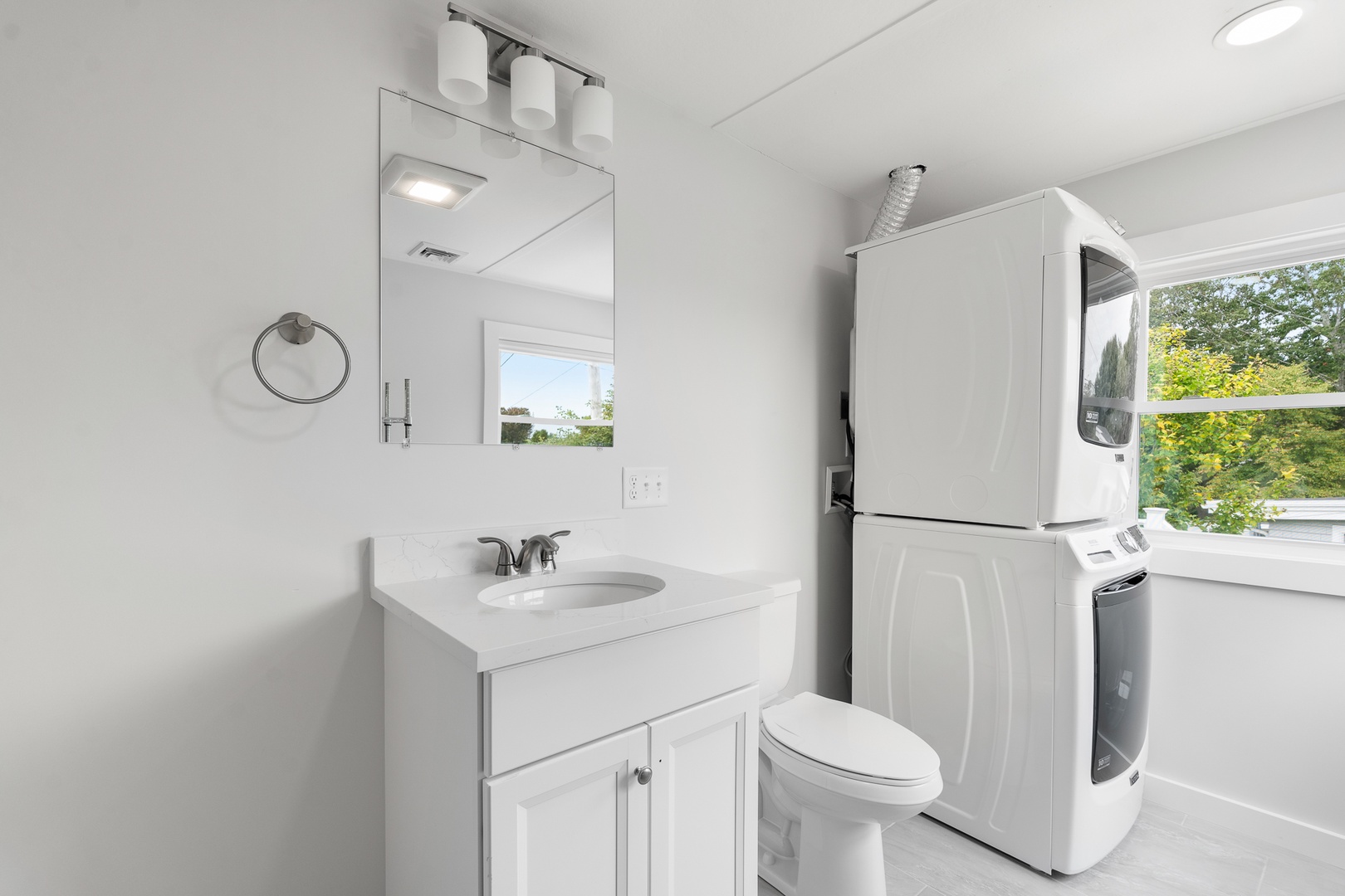 The washer and dryer is located in the half-bathroom.