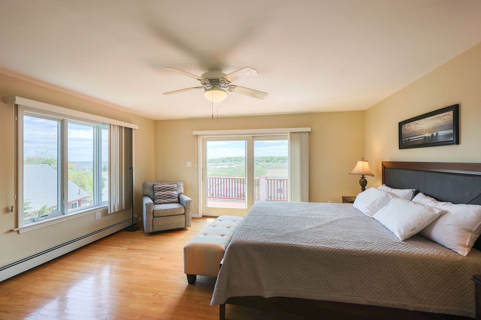 Primary bedroom with beautiful views of Good Harbor Beach out the window