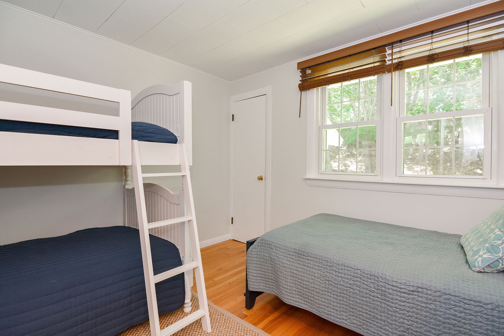 Bunk room with three twins.