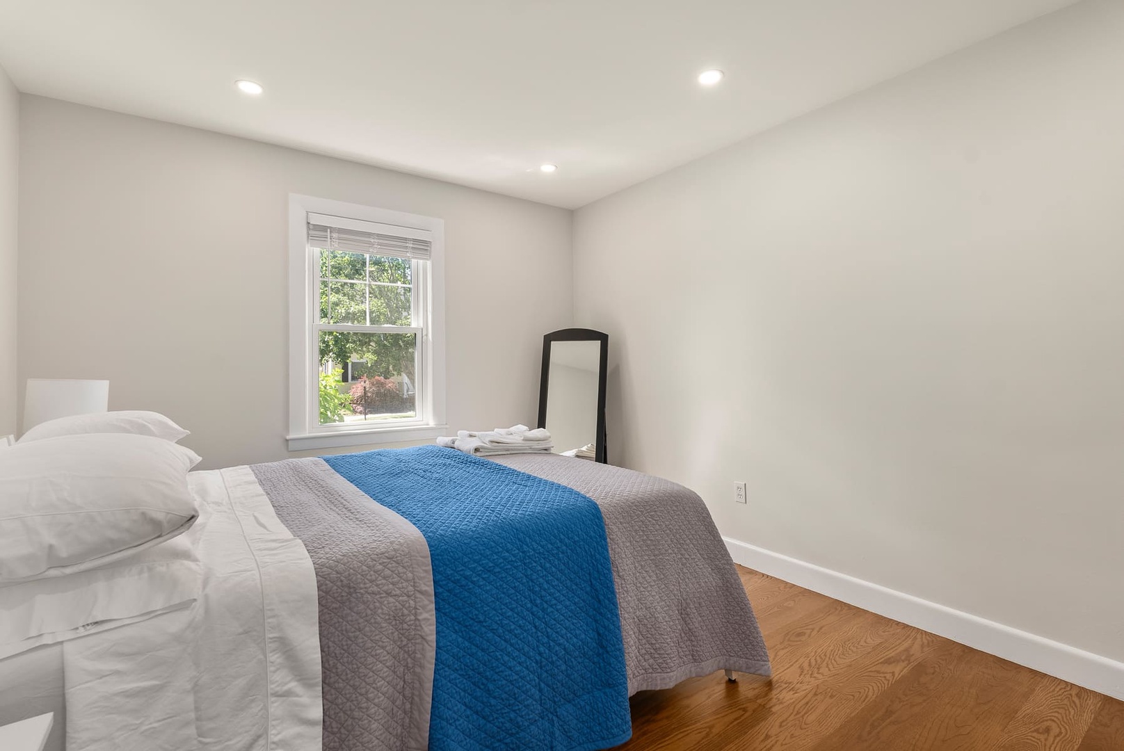 The primary bedroom with a queen bed on the ground floor.