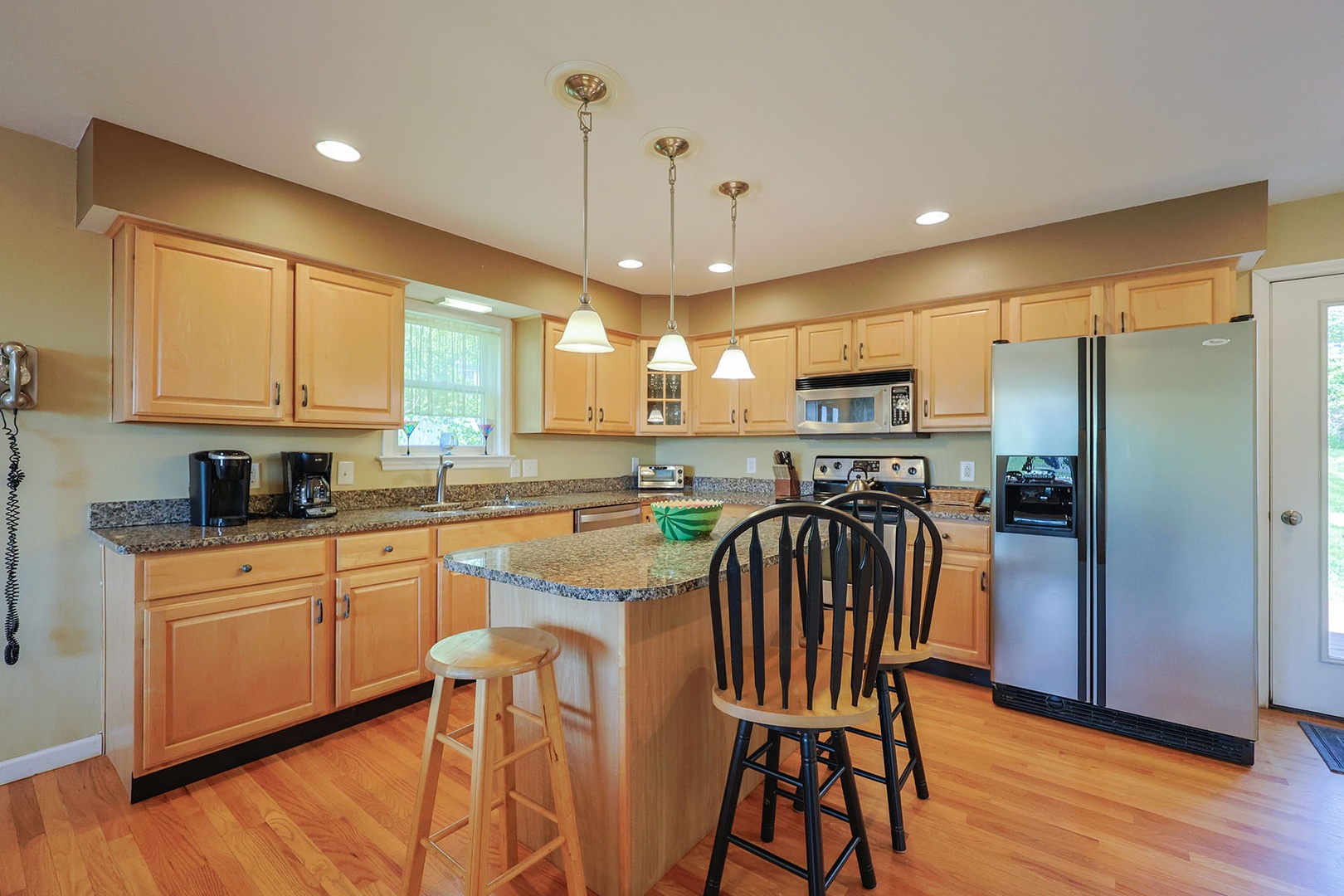 A fully-applianced eat-in kitchen with center island
