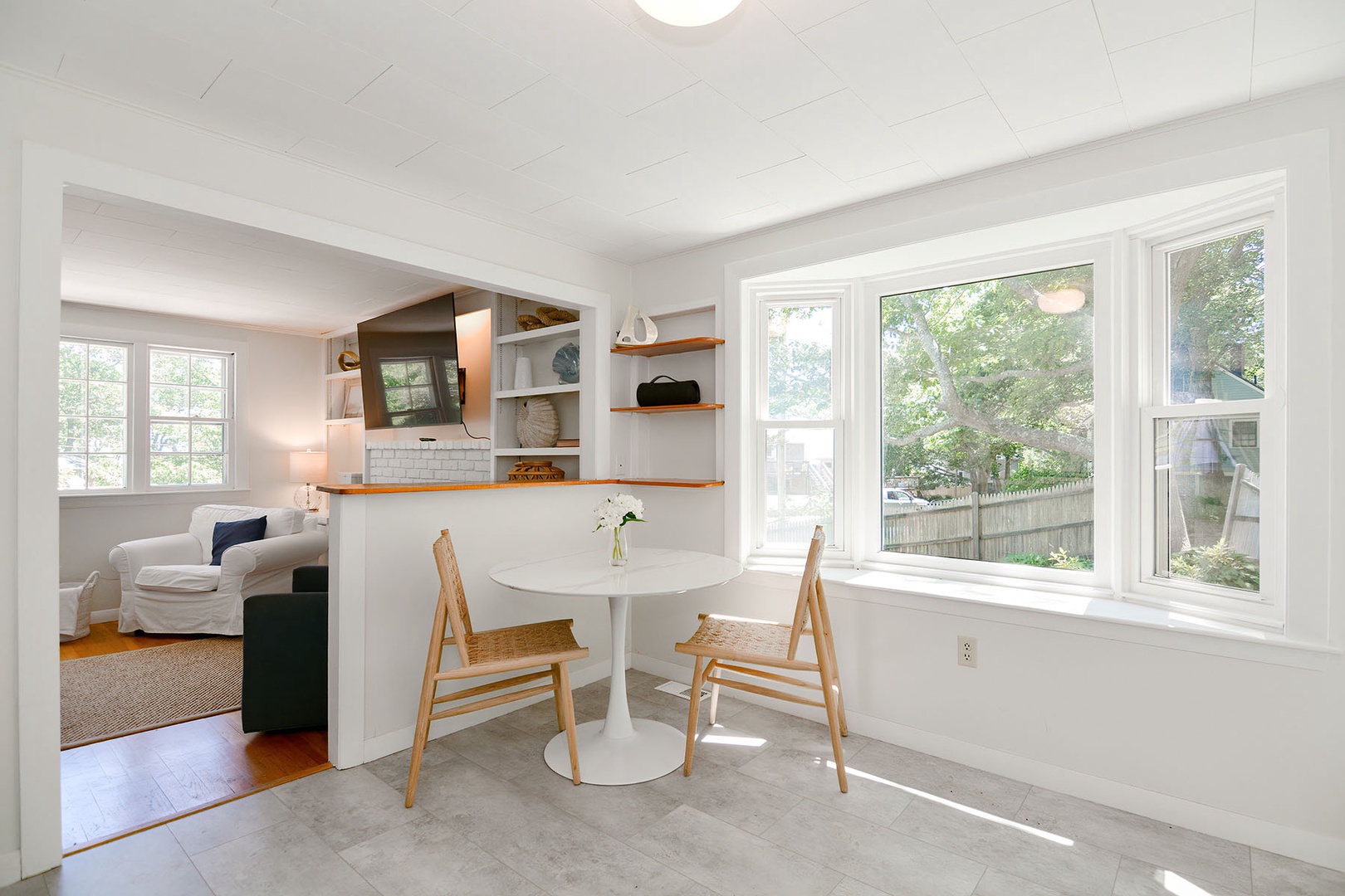 Small dining area with two chairs and bench seating.