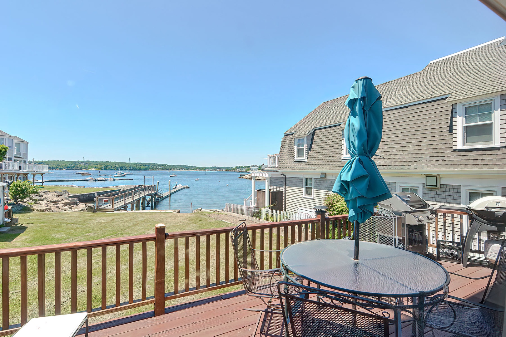 The backyard, the dock, and the cove beyond.