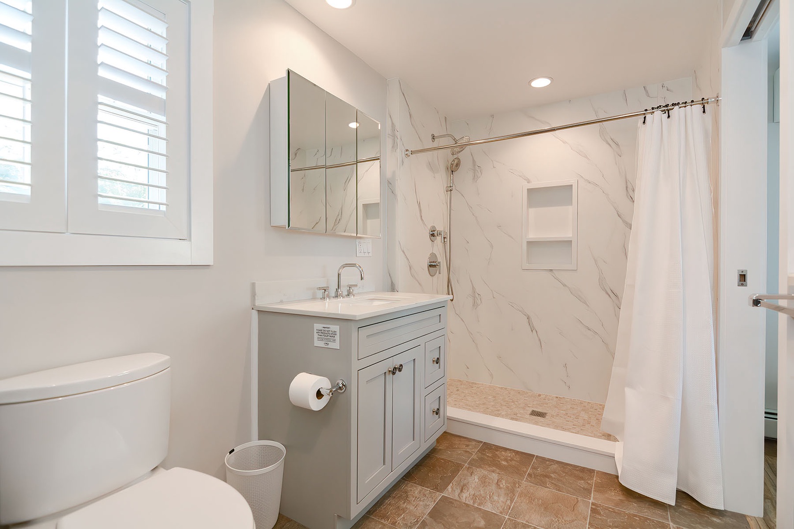 Second level bathroom with walk-in shower.