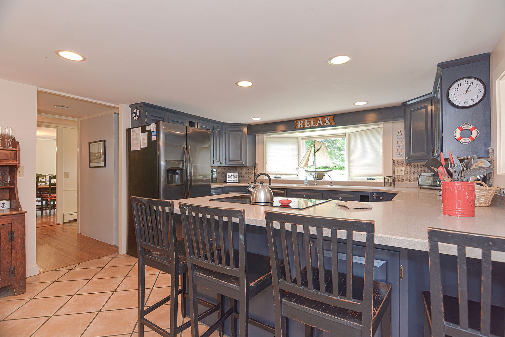 The large eat-in kitchen seat four at the breakfast bar and views overlooking the courtyard.